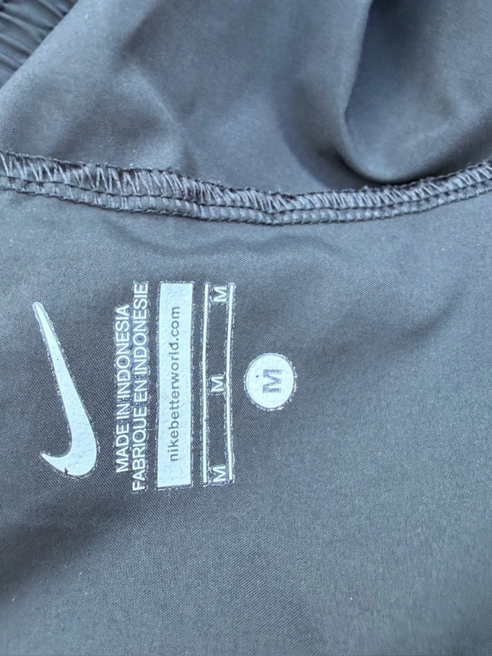 Nike Black running pants with White Care Tag